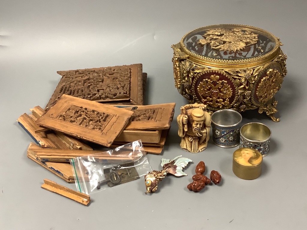 A quantity of mixed Oriental wares to include a dismantled boxwood casket, cloisonne napkin rings etc and a Russian jewellery casket